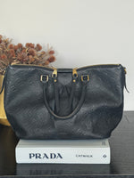 Louis Vuitton| Black Embossed Leather Marazine MM